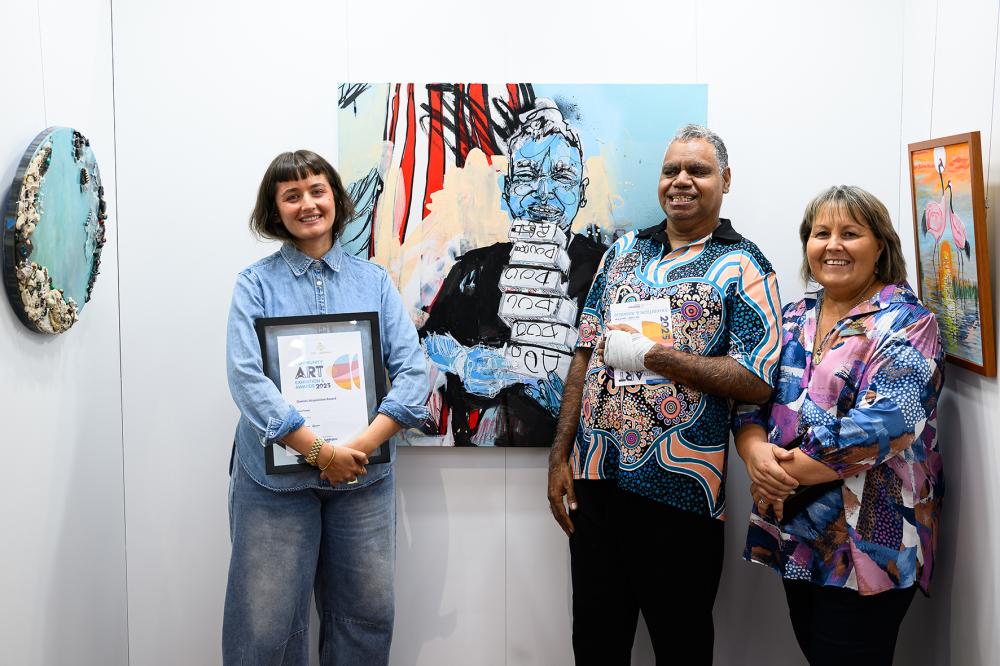 Mayor Terresa Lynes (right) with 2025 City of Gosnells Community Art Exhibition and Awards Overall Acquisitive Award winner Ariel Katzir (left) and the subject of her winning portrait, Darryl Dempster. Will you be the next winner?