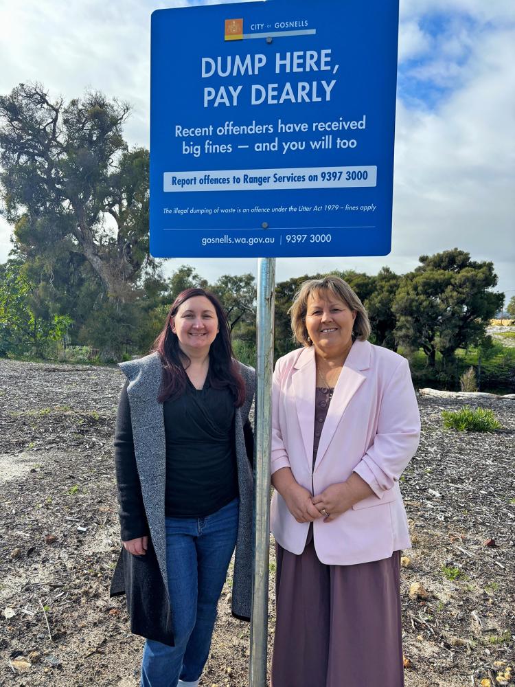 City of Gosnells Mayor Terresa Lynes (right) and Deputy Mayor Serena Williamson with one of the new signs discouraging illegal dumping on Holmes Street in Southern River.