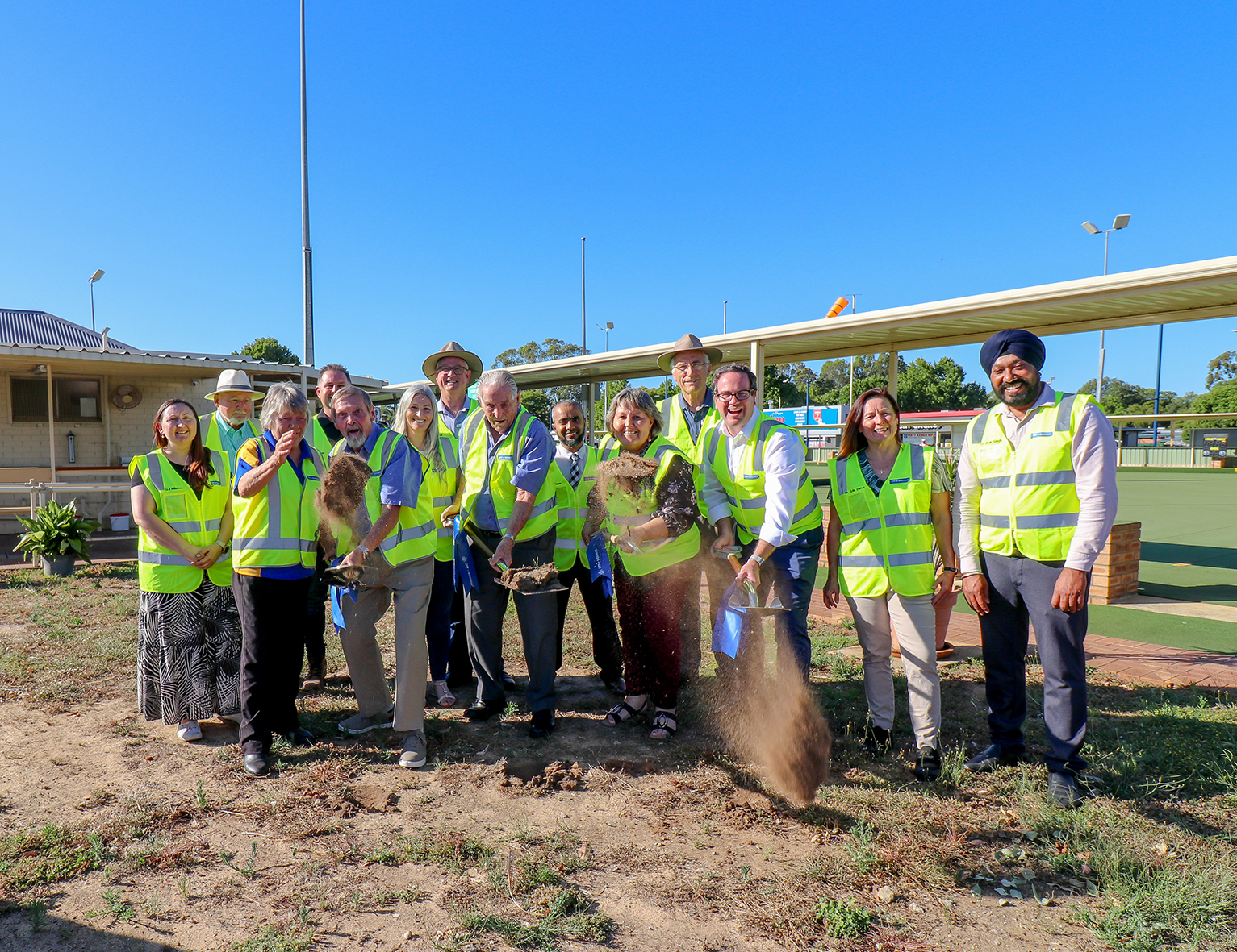 Mayor Terresa Lynes and Member for Burt Matt Keogh and Gosnells Bowling  Club representatives Peter Charkiewicz and Brian Fox turn the first sod for the new  clubhouse extension. They are watched on by Councillors Serena Williamson, Aaron  Adams, Diane Lloyd, David Goode, Saiful Islam, Peter Abetz, Kylie Dalton and Balli  Singh, with Gosnells Bowling Club President Hazel McGinty