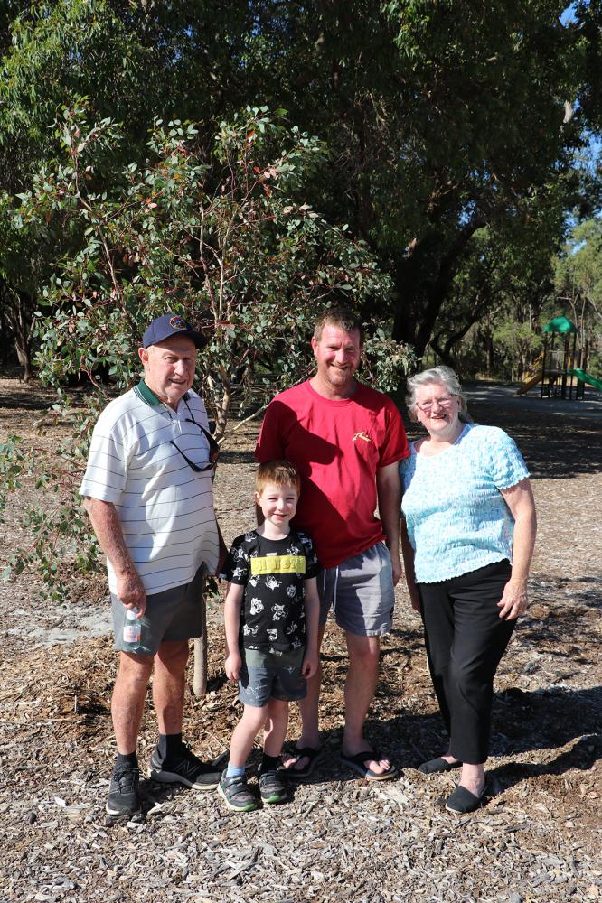 Caption – Fred, Jackson, Phil and Margaret Sharp with the tree they purchased in the  Community Forest at John Okey Davis Park, in Gosnells. The Sharp family purchased the  tree, which they named Groot, because they wanted to support more trees being planted  in the neighbourhood
