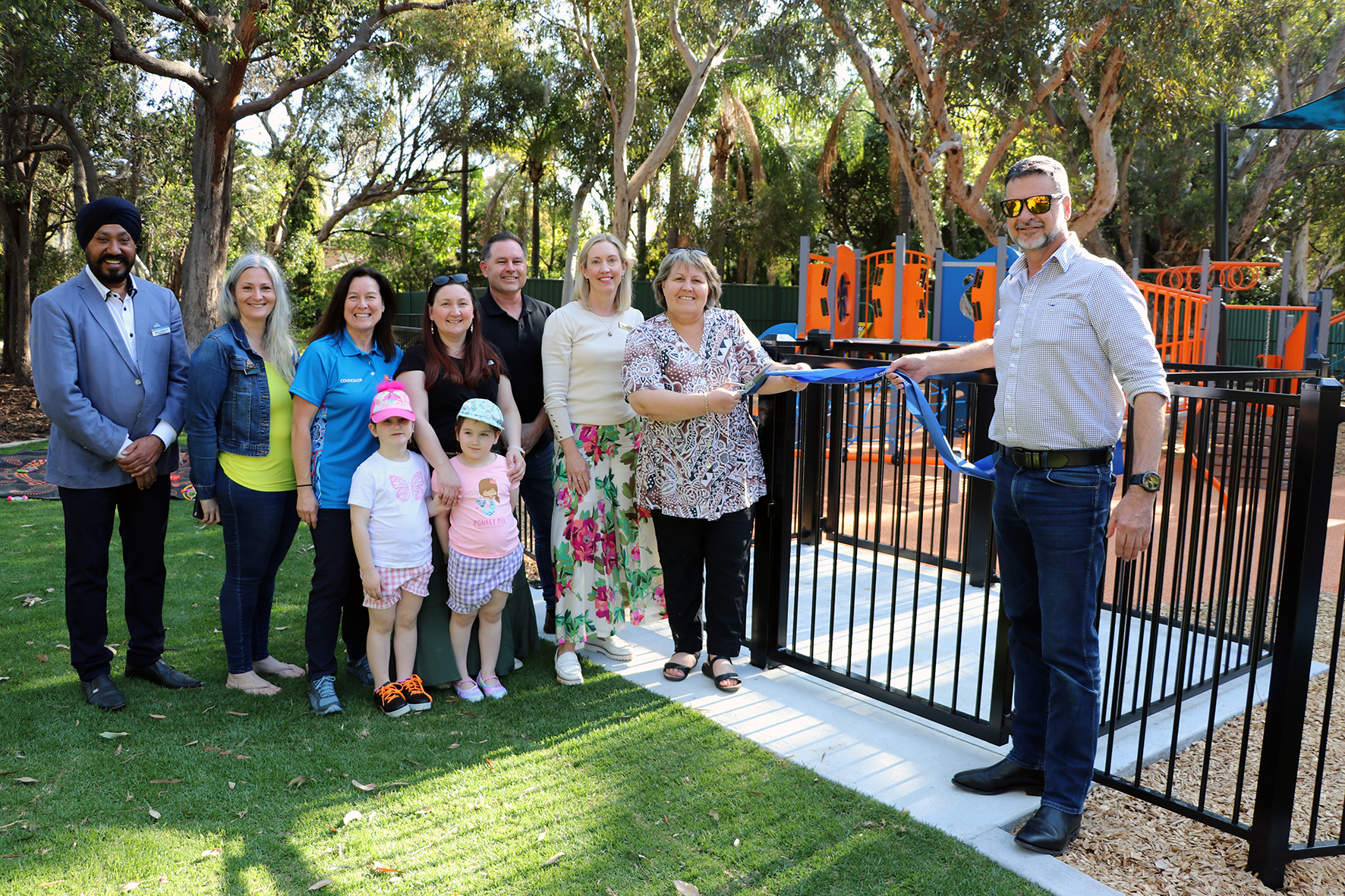 Mayor Terresa Lynes and Boral General Manager Concrete and Quarries Craig  Excell cut the ribbon to open the new playground at Boyle Park in Orange Grove, watched  by (left – right) Councillors Balli Singh, Diane Lloyd, Kylie Dalton, Serena Williamson with  her daughters Katie and Gemma, Aaron Adams and Caren Baayens