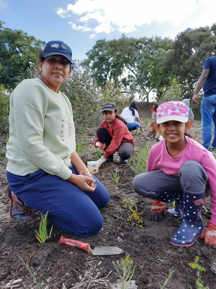 Caption – Theres Levina and Judeena Jesuthasan planted native seedlings at the 2023  Give Our Bushland a Boost event.