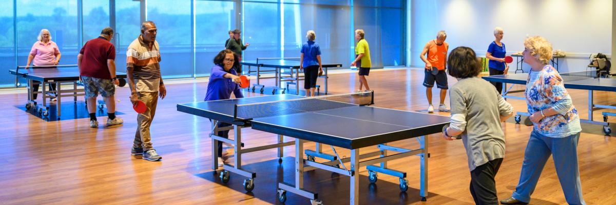 Image of seniors playing table tennis