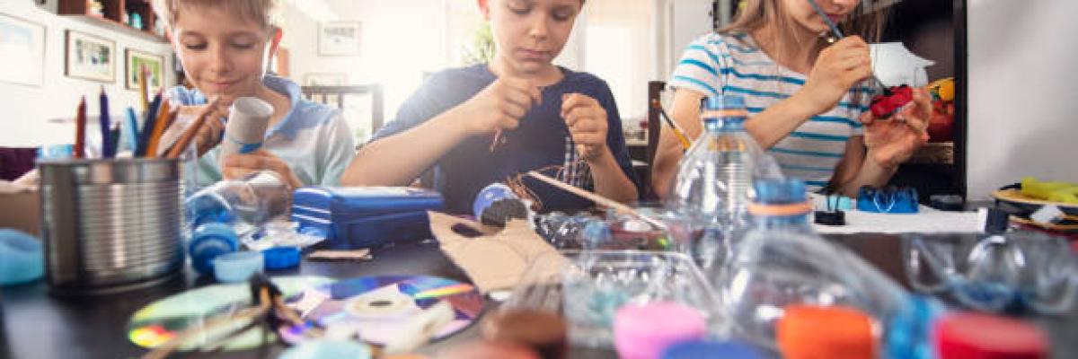 Kids crafting with recycled items