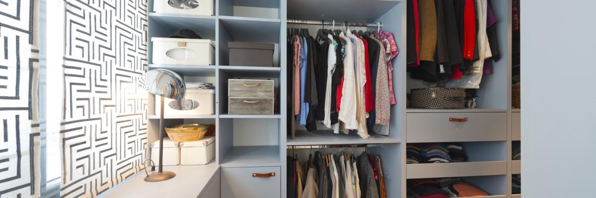 A neatly organised and compartmentalised wardrobe full of clothes