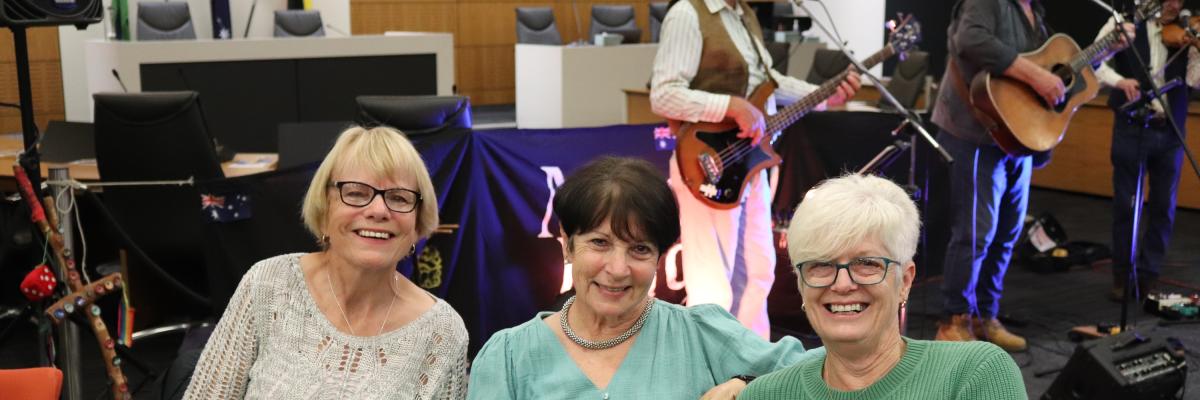 3 Ladies sitting at dinner 