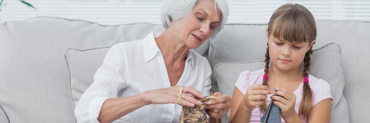 Grandmother teaching grandaughter knitting