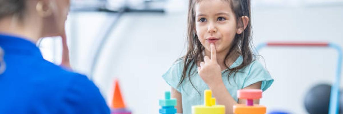 speech pathologist working with child