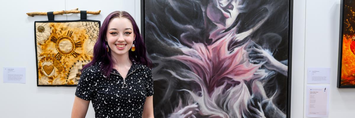People's Choice Award winner Casper Green poses with her winning artwork