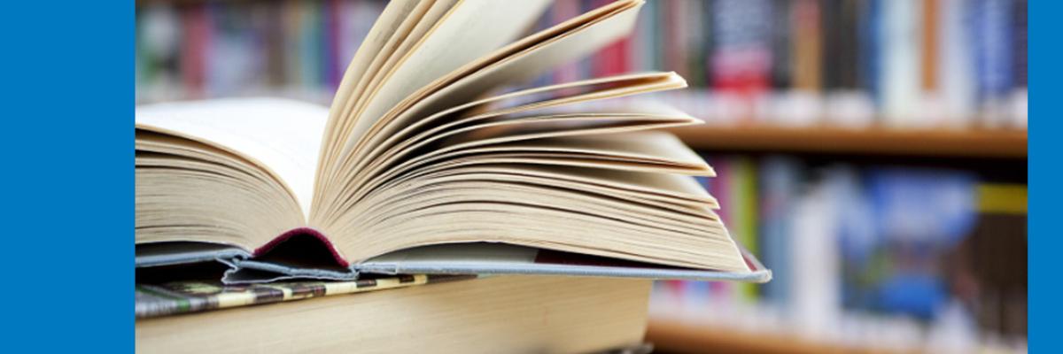 Open book with shelves in the background