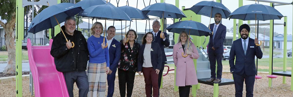 Councillors Glenn Dewhurst, Caren Baayens, Aaron Adams, Mayor Terresa Lynes and Councillors Kylie Dalton, David Goode, Diane Lloyd, Saiful Islam and Balli Singh didn’t let the weather stop them from checking out the new playground at Woodswallow Park in Maddington.