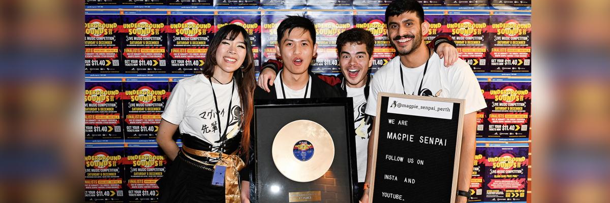 Underground Sounds 2025 first-place winners, Magpie Senpai with their iconic golden record.