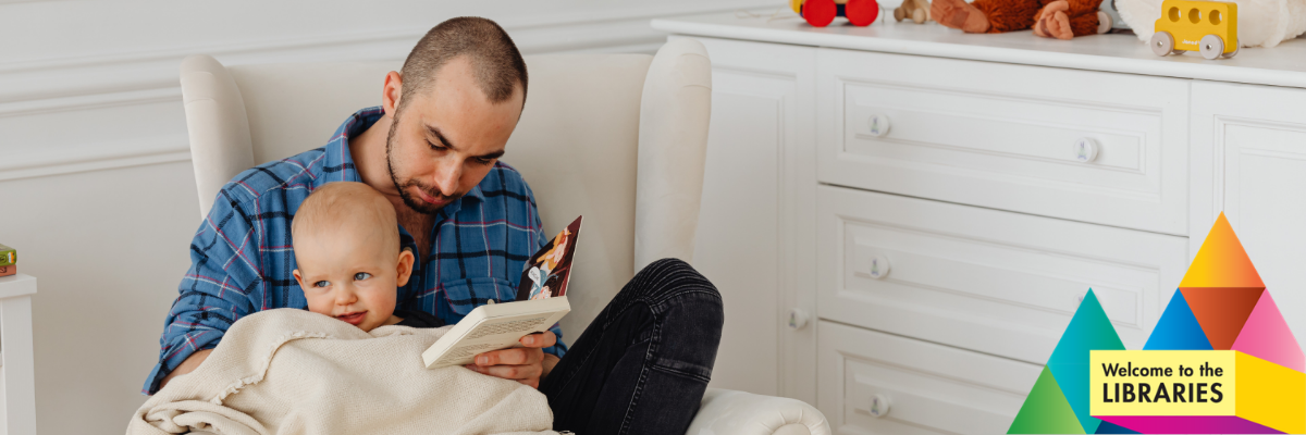 dad reading to baby