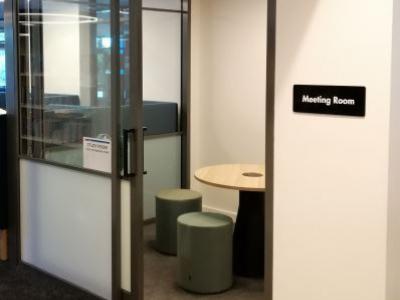 small meeting room with four chairs and a table