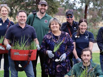 City of Gosnells Mayor Terresa Lynes (centre), Councillor Aaron Adams, staff from the City WALGA and AGLG get ready to plant thousands of understorey plants at Atkinson Reserve in Canning Vale.