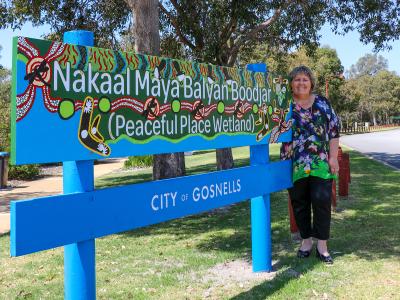 Mayor Terresa Lynes with one of the new signs installed around the renamed  Wetlands bordered by Shreeve Road and Waterperry Drive in Canning Vale