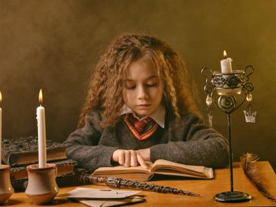 Child reading spell book 