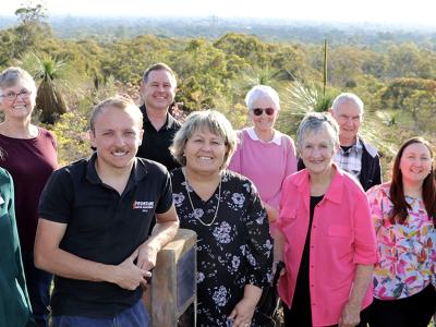 Caption – John Bowler’s grandson Kyle Scott Thompson and City of Gosnells Mayor Terresa Lynes (centre) celebrate the unveiling of a memorial plaque for John at Ellis Brook Valley. Also pictured are Councillor Kevin McDonald, Cr Peter Abetz, Environmental Officer Rachel Fitzgerald, Former Friends of Ellis Brook Valley member Jennie Greville, Cr Aaron Adams, Former Friends of Ellis Brook Valley members Rosemary and Rod Thompson, Armadale-Gosnells Landcare Group Chair Pat Hart, Cr Serena Williamson, Cr Caren B