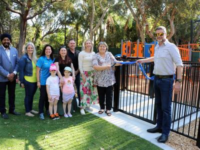 Mayor Terresa Lynes and Boral General Manager Concrete and Quarries Craig  Excell cut the ribbon to open the new playground at Boyle Park in Orange Grove, watched  by (left – right) Councillors Balli Singh, Diane Lloyd, Kylie Dalton, Serena Williamson with  her daughters Katie and Gemma, Aaron Adams and Caren Baayens.