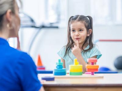 speech pathologist working with child