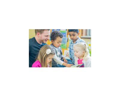 A man and several children looking at a picture book