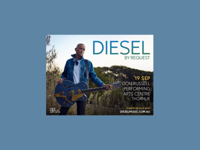 Diesel, By Request. Diesel stands in an outdoor bush setting, holding a blue guitar, and wearing a white-tshirt, blue denim jacket, black jeans and a blue bandana tied around his neck.