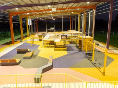 View under YES roof showing hangout area including seating, swings and mouse wheel