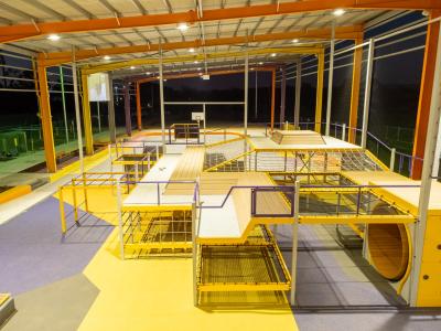 View under YES roof showing hangout area including rope seating and mouse wheel