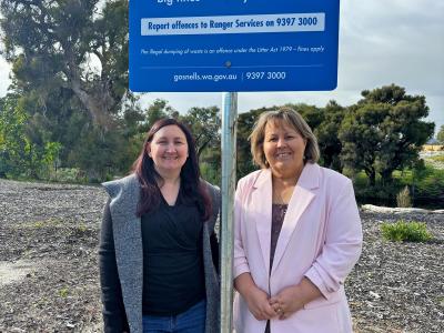 City of Gosnells Mayor Terresa Lynes (right) and Deputy Mayor Serena Williamson with one of the new signs discouraging illegal dumping on Holmes Street in Southern River.