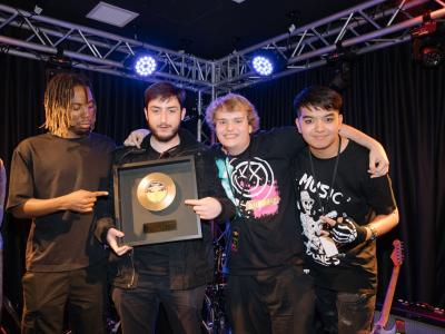 Cities Band holding their 2nd Place Golden Record