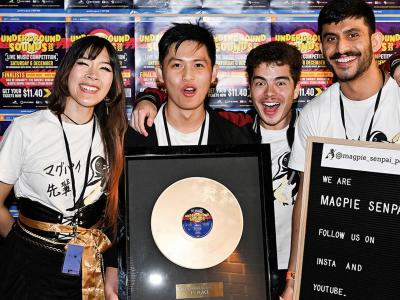 Underground Sounds 2025 first-place winners, Magpie Senpai with their iconic golden record.