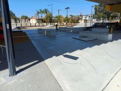 Skate park under shade of overhead rail line
