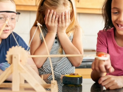 Kids building catapults.