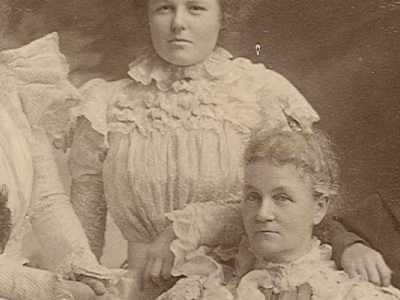 An old sepia photo of five people from the Liddelow family circa 1896